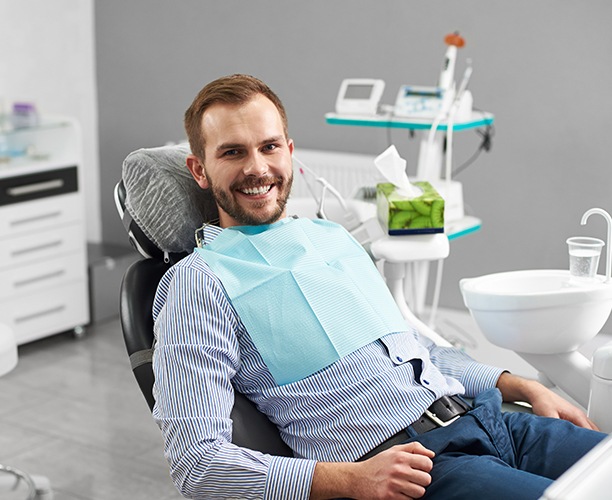 Man in dental chair smiling