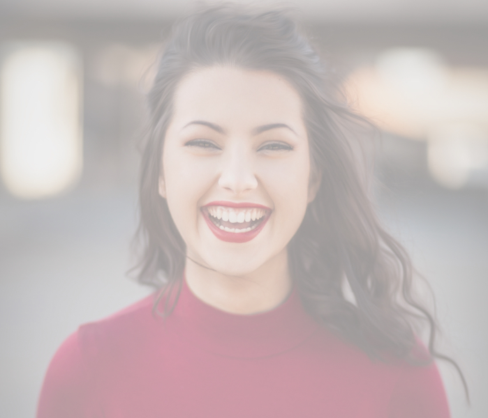 Smiling woman with bright red lipstick