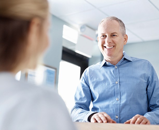 Man checking in at dental office