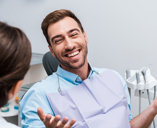 Laughing man in dental chair