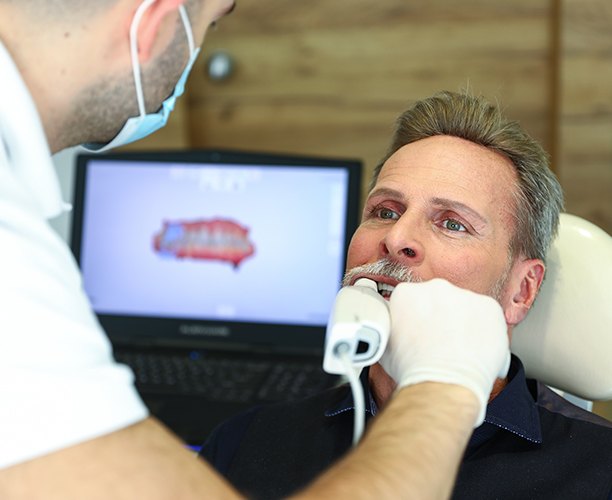 Dentist capturing digital bite impressions