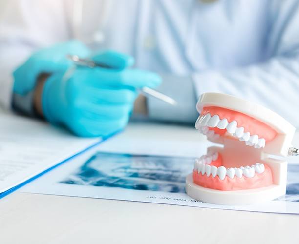 dentist explaining dentures in Las Cruces