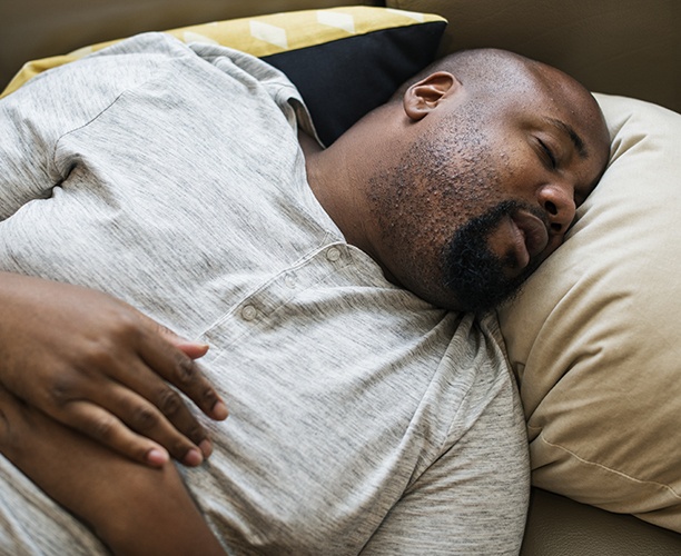 Man with nightguard sleeping soundly