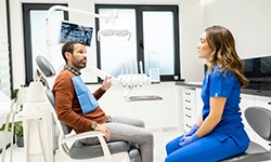 Patient and dental team member engaged in conversation