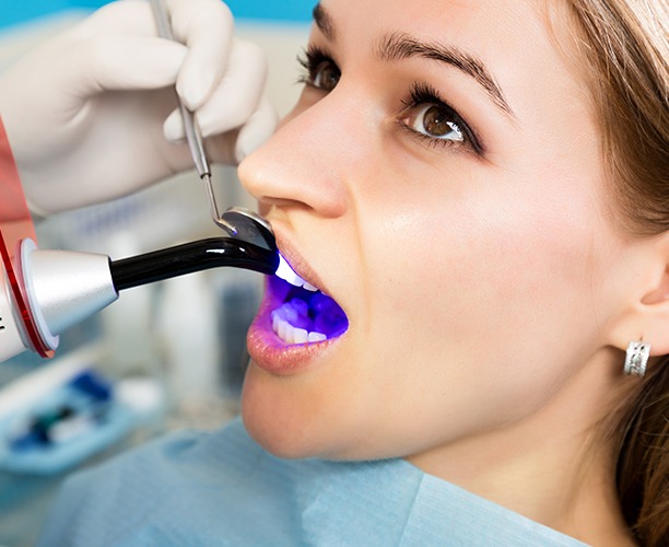 Patient receiving direct tooth bonding