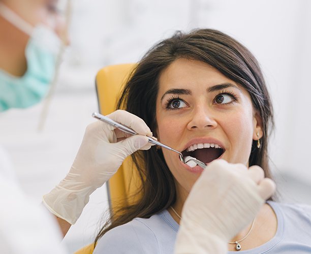 Woman receiving root canal therapy