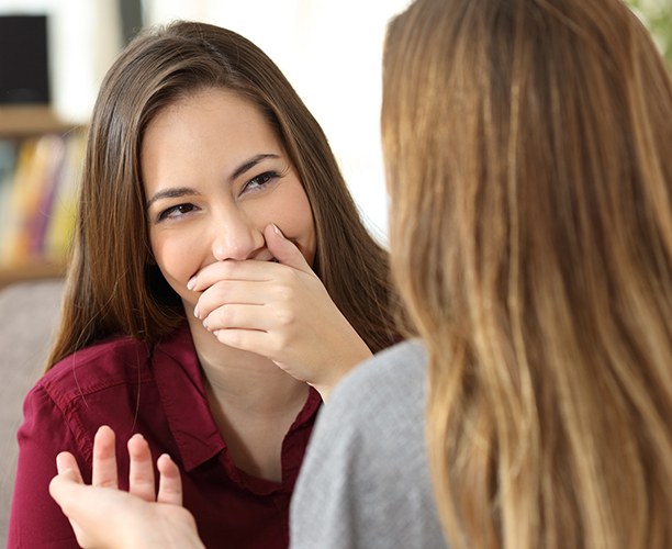Woman with flawed smile before porcelain veneers covering her mouth