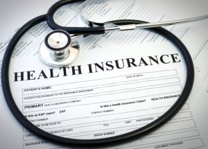 health insurance form with stethoscope