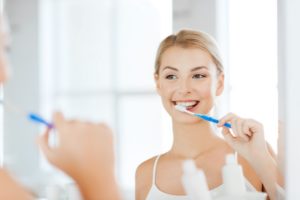 woman brushing her teeth