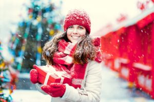 woman with gift smiling