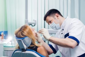 Woman at appointment with dentist in Las Cruces.