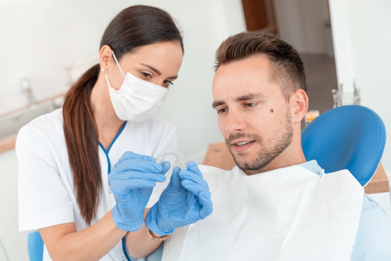 Man getting Invisalign at dentist