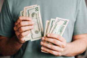 Man's hands counting cash