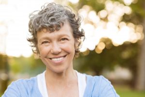 older woman smiling outdoors