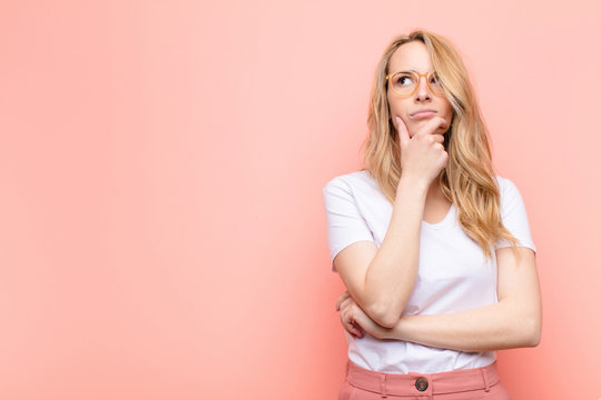 puzzled person questioning if white teeth are always healthy teeth