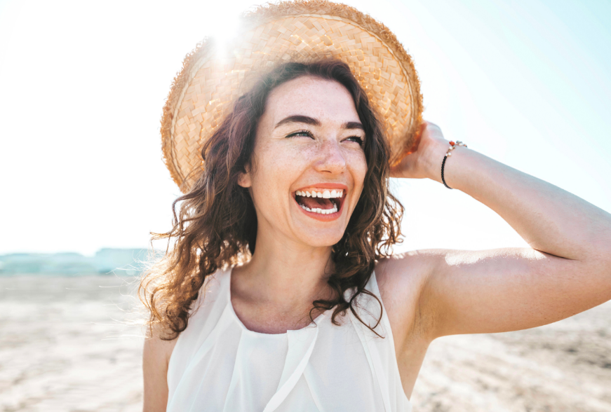 Woman smiling on a beach